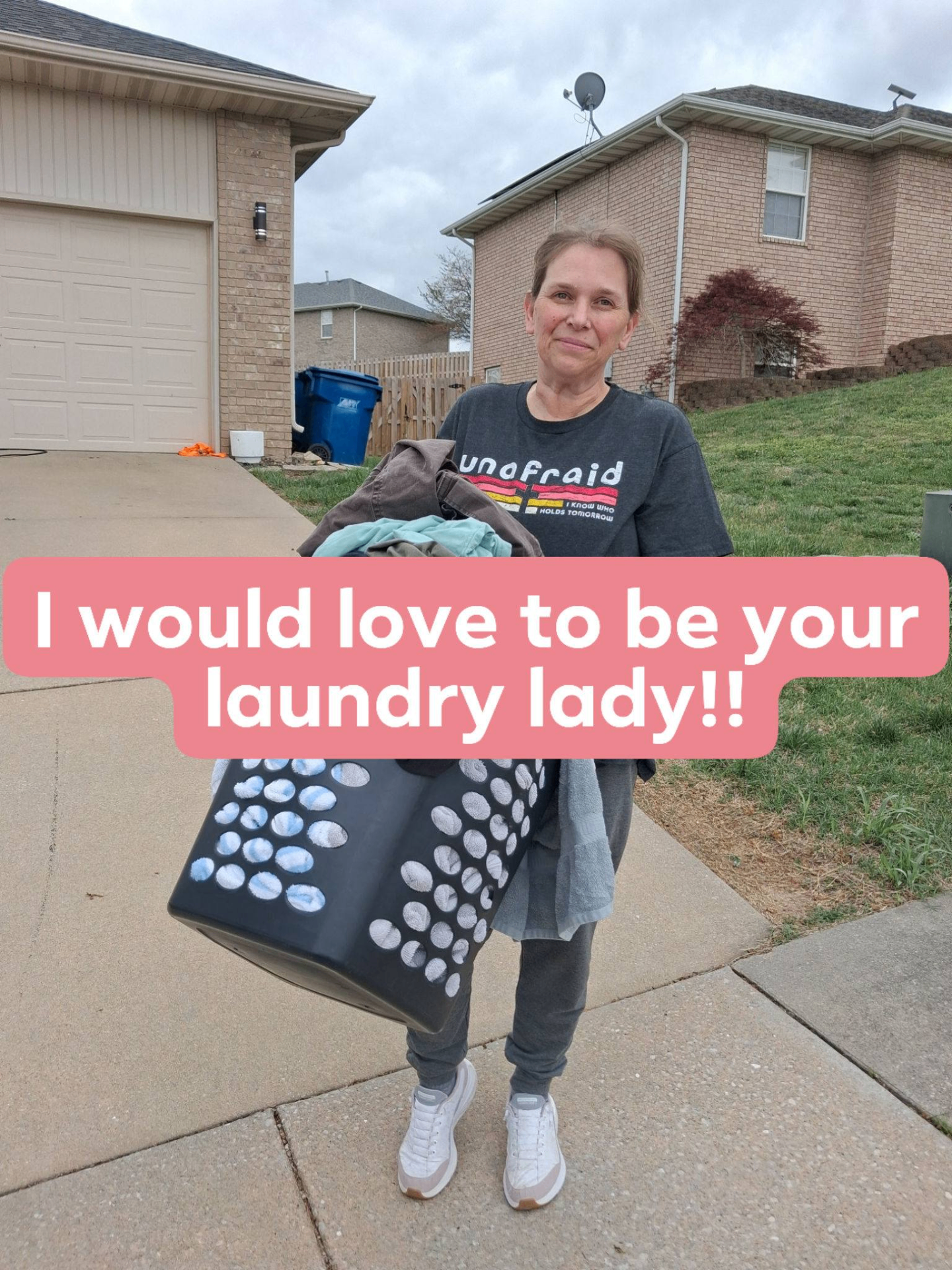 Susie holding a laundry basket — your local laundry lady